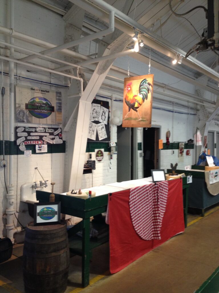 Market booth with Massey Creek Farms signage